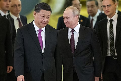 Chinese President Xi Jinping, left, and Russian President Vladimir Putin enter a hall for talks in the Kremlin in Moscow, Russia, June 5, 2019. (Photo | AP)