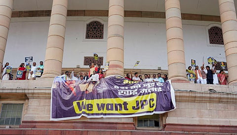 Opposition MPs protest, on the first floor of the Parliament in New Delhi, demanding a joint parliamentary committee (JPC) probe into the Adani Group, March 21, 2023. (Photo | PTI)