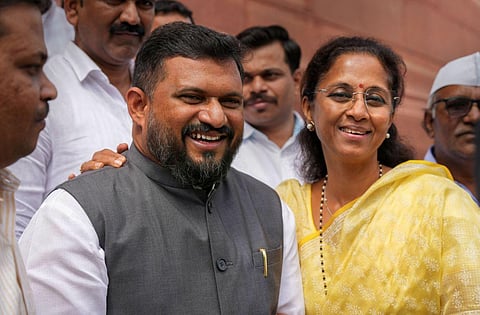 NCP MP Supriya Sule (R) with party MP from Lakshadweep Mohammad Faizal P P, at Parliament House complex in New Delhi, Wednesday, March 29, 2023. (Photo | PTI)