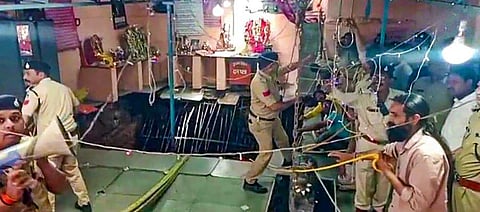 Police personnel conduct a rescue operation for those trapped in the stepwell at a temple following its collapse, at Patel Nagar area, in Indore on Thursday. (Photo | PTI)