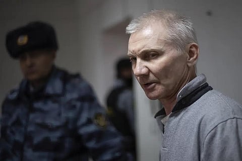 Alexei Moskalyov, right, is escorted from a courtroom in Yefremov, Tula region, some 300 kilometers (186 miles) south of Moscow, Russia, Monday, March 27, 2023. (Photo | AP)