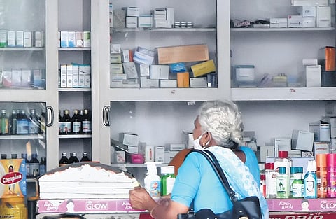 A woman buying medicines at a pharmacy (Photo | Express)