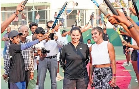 Students of Sania Mirza Tennis Academy welcoming the tennis star during a press meet in Hyderabad on Saturday |  MANHAL