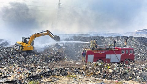 Firefighting operations being carried out at Brahmapuram waste treatment plant in Kochi on Sunday | A Sanesh