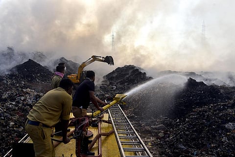 Firefighting operations being carried out at Brahmapuram waste treatment plant in Kochi. (Photo | A Sanesh, EPS)