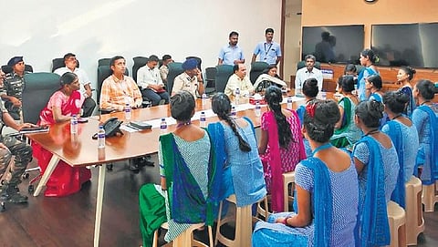 Jharkhand officials interacting with migrant workers of a spinning mill in Tiruppur district on Monday | Express