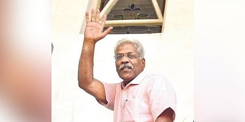 ​  Chief minister’s additional private secretary C M Raveendran waving at journalists while entering the ED office in Kochi on Tuesday | A Sanesh  ​