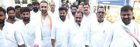 ​  TPCC president A Revanth Reddy and other Congress leaders leave the office of the Enforcement Directorate after complaining, in Hyderabad on Friday  ​