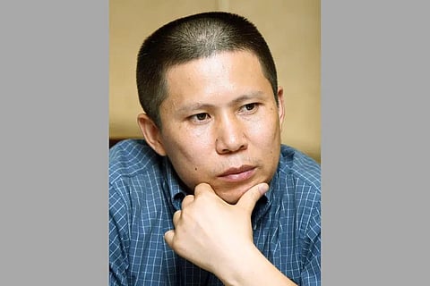 FILE - Legal scholar Xu Zhiyong is seen at a meeting in Beijing, China, on July 17, 2009. (Photo | AP)
