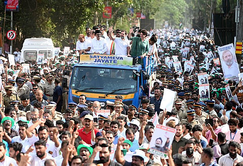 Congress leaders Rahul Gandhi and Priyanka Gandhi, accompanied by UDF leaders, wave at the crowd of supporters during a road show held at Kalpetta in Wayanad. (Photo | E Gokul, EPS)