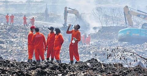 Firefighters during the last stage of operations at Brahmapuram. (Photo | A Sanesh)
