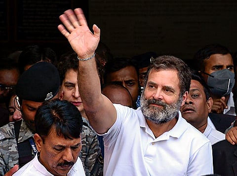 A file photo of Congress leader Rahul Gandhi waving at supporters as he leaves from Surat District Court. (Photo | PTI)
