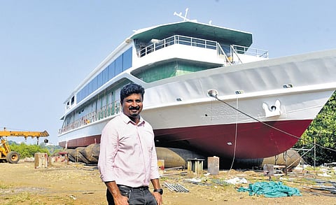 Nishijith K John in front of newly built Classic Imperial ship at Ramanthuruth, near  Vallarpadam, on Sunday | A Sanesh