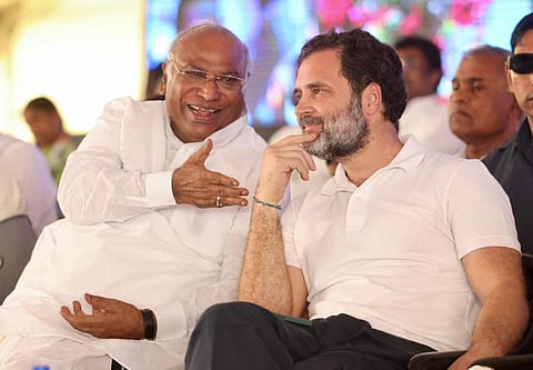 Congress leader Rahul Gandhi and AICC president Mallikarjun Kharge share a light moment during the Jai Bharat rally in Kolar on Sunday | Nagaraja Gadekal