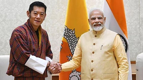 Bhutan King Jigme Khesar Namgyel Wangchuck shakes hands with Prime Minister Narendra Modi. (File photo | PTI)