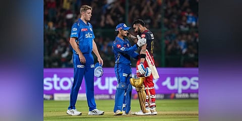 RCB batter Virat Kohli congratulates by MI players after winning over MI during the IPL 2023 match between RCB  and MI. (Photo | PTI)