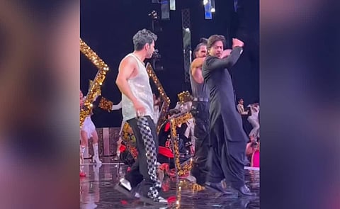 Shah Rukh Khan, Varun Dhawan and Ranveer Singh during a performance.