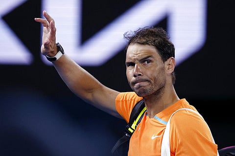 Rafael Nadal of Spain waves as he leaves Rod Laver Arena following his second round loss to Mackenzie McDonald of the U.S. at the Australian Open tennis championship. (File Photo | AP)