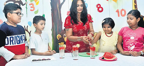 Home chef Priya Kolassery prepares summer coolers and popsicles with children  at Tagore Kindergarten, Kumarapuram. | B P Deepu