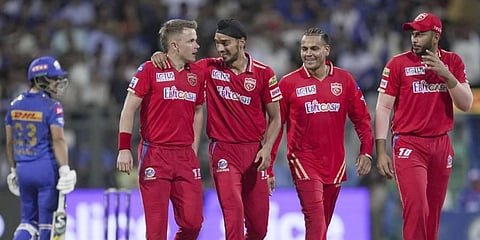 Arshdeep Singh and Sam Curran (L) celebrate the wicket Ishan Kishan during the IPL match between PBKS and MI at Wankhede Stadium in Mumbai, April 22, 2023. (Photo | PTI)