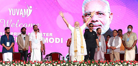 Prime Minister Narendra Modi waving at the crowd during Yuvam 2023 conclave at SH College in Thevara, Kochi. (Photo | T P Sooraj, EPS)