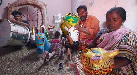 Kumaravel along with his family members making Thiruvatchi for Chithirai festival. (Photo | KK Sundar, EPS)