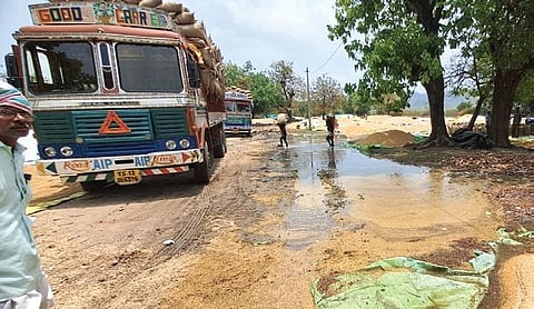 Paddy stalks strewn for drying, lie damaged at a paddy purchase center in  Srikonda mandal of Nizamabad district on Tuesday