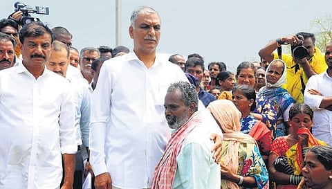 Finance Minister Harish Rao consoles a farmer who broke down while narrating the crop loss he suffered in Dubbaka constituency on Wednesday. (Photo Express)
