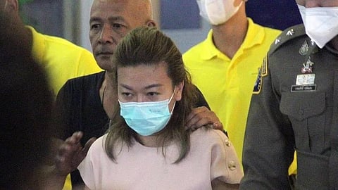 Sararat Rangsiwuthaporn in police custody. (Photo | Royal Thai Police handout)
