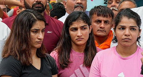 Vinesh Phogat, Sakshi Malik and Sangita Phogat during their protest at Jantar Mantar, in New Delhi, Thursday, April 27, 2023.(Photo | PTI)
