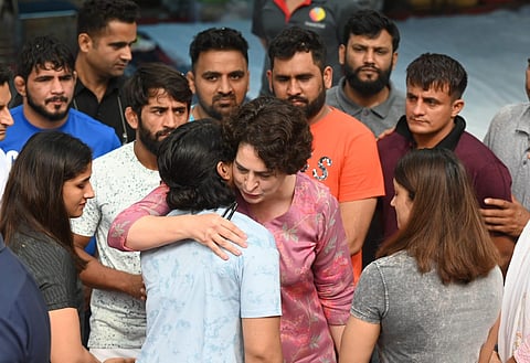 Congress leader Priyanka Gandhi embraces Sakshi Malik during her visit to meet the protesting Wrestlers at Jantar Mantar in New Delhi on Saturday. (Photo | Shekhar yadav, EPS)