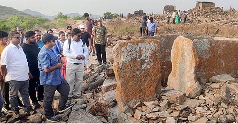 Krishnagiri Collector Deepak Jacob with others visiting a Dolmen site dating back to the iron age in Mallachandram near Shoolagiri.