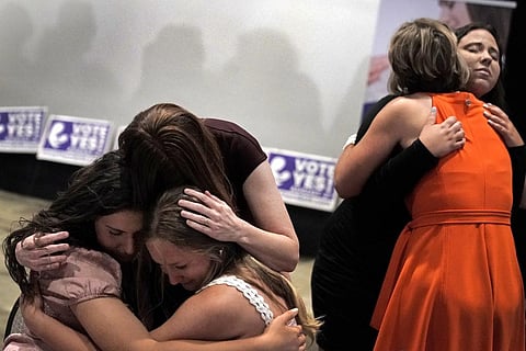 People hug during a 'Value Them Both' watch party after a question involving a constitutional amendment removing abortion protections from the Kansas constitution failed. (Filr Photo  |AP)