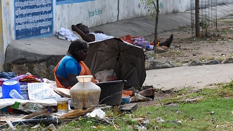 The homeless by the side of Amma Mandapam Road in Tiruchy.  (Photo | MK Ashok Kumar, EPS)