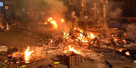 Vehicles set on fire by miscreants during clashes between two groups.