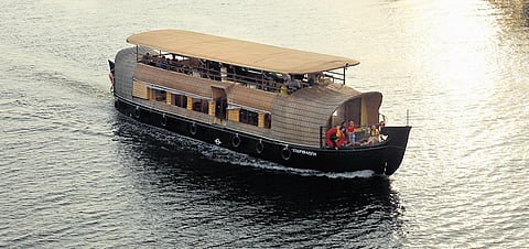 A houseboat cruises through the backwaters in Kochi | T P Sooraj