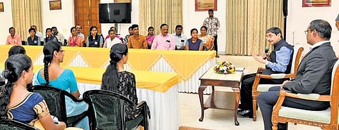 Governor RN Ravi talking to Class 12 board exam  toppers at Raj Bhavan on Wednesday | Express