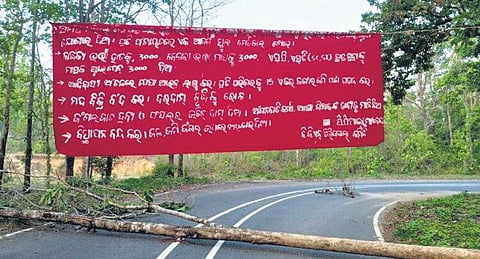Maoist poster put up along a blocked road in Rayagada district | Express