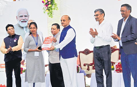 Union Minister of State for Finance Bhagwat Kishanrao Karad hands over appointment order to a candidate at the 5th Rozgar Mela in Visakhapatnam  on Tuesday I G Satyanarayana
