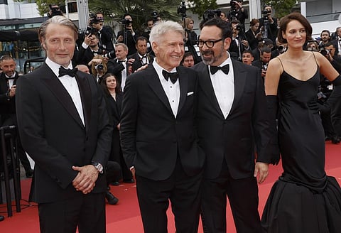 Mads Mikkelsen, from left, Harrison Ford, director James Mangold and Phoebe Waller-Bridge pose at the premiere of the film 'Indiana Jones and the Dial of Destiny', Cannes. (Photo | AP)