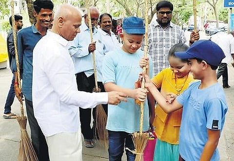 TTD executive officer AV Dharma Reddy taking part in the cleanliness drive,  Sundara Tirumala-Suddha Tirumala, along with volunteers at Tirumala I Express