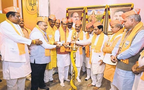 Chief Minister Shivraj Singh Chouhan joins state BJP leaders to light traditional lamp before the state party executive meeting in Bhopal on Friday  | EXPRESS