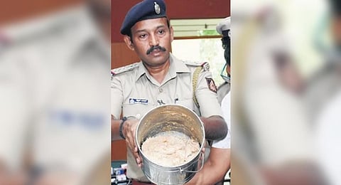 Police display ambergris which was seized, at a press meet in Mysuru on Tuesday | Express