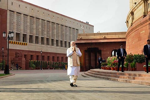 Prime Minsiter Modi infront of the new parliament building. (photo | PTI)