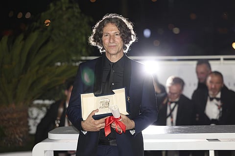 Jonathan Glazer, winner of the jury prize award for 'The Zone of Interest', poses during a photo call following the awards ceremony at the 76th international film festival, Cannes. (AP)