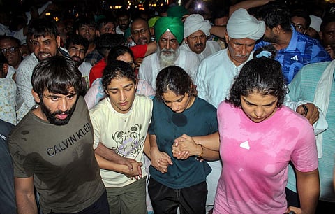 Protesting wrestlers Bajrang Punia, Sakshi Malik, Vinesh Phogat and Sangeeta Phogat at Har ki Pauri ghat, in Haridwar, Tuesday, May 30, 2023. (Photo | PTI)