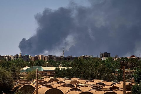 FILE: Smoke billows over buildings in Khartoum on May 1, 2023 as deadly clashes between rival generals' forces have entered their third week. (Photo | AFP)