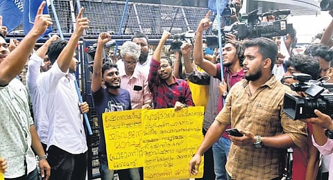 Members of Fraternity Movement protest in front of Shenoy’s theatre in Kochi 