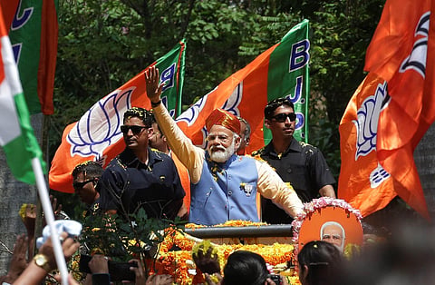 People gathered on either side of the road waiting since morning. Modi was seen wearing the traditional Mysuru Peta. (Photo | Shashidhar Byrappa, EPS)