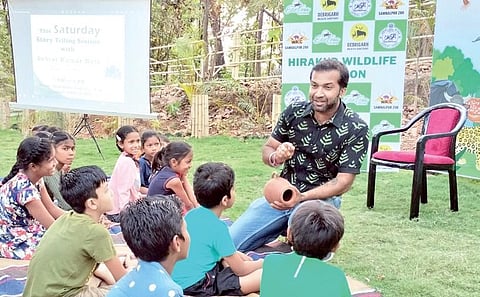 A storyteller engaging children in an activity at  the Sambalpur  zoo | Express